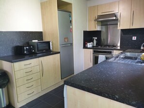 Fridge, microwave, oven, stovetop - Wooden lodge with front decking sleeps 9 people (Fleetwood)