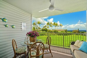Outdoor dining - Modern oceanview condo with private lanai, shared pool, hot tubs & tennis court (Princeville)