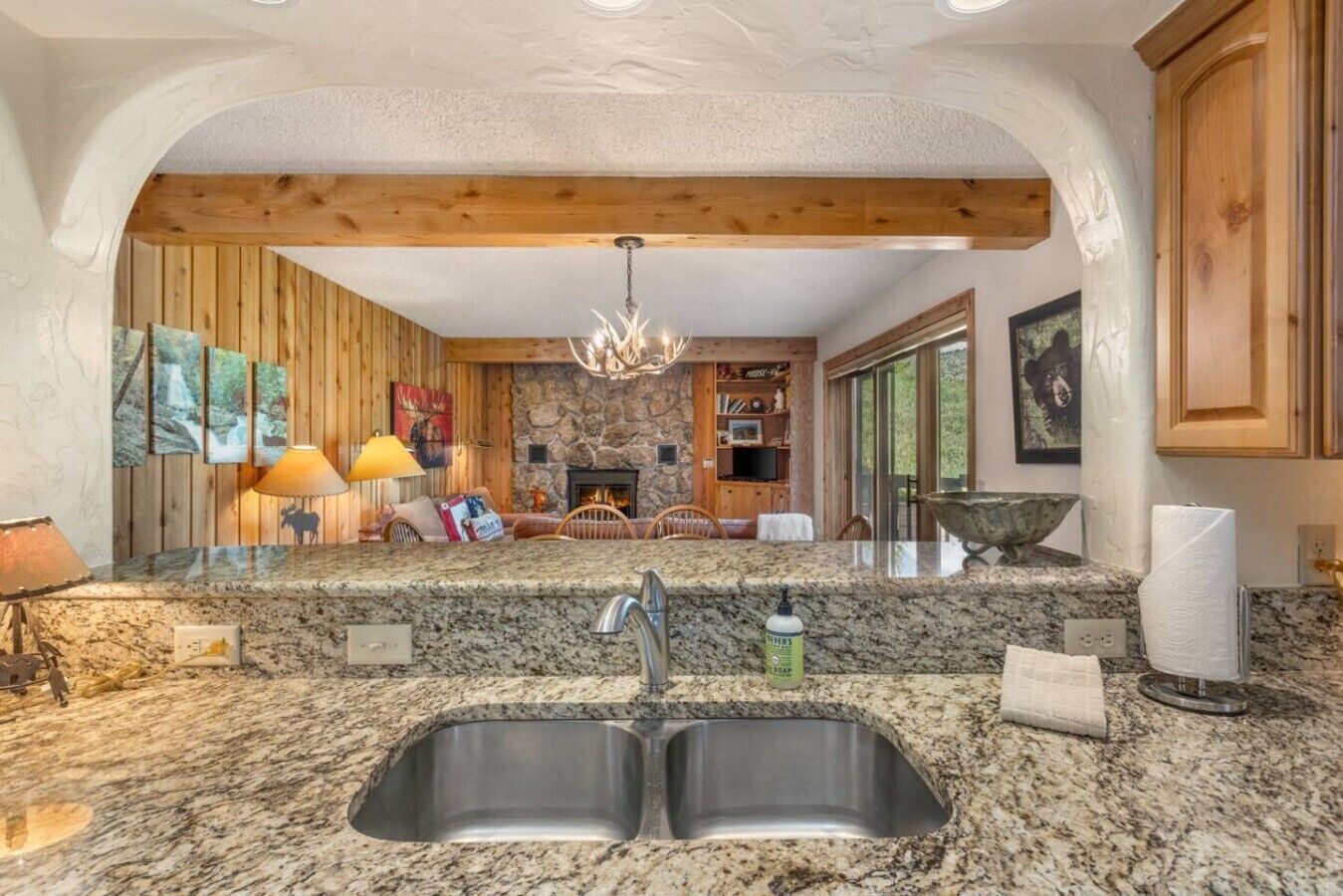 Sunlight pours in while breathtaking valley views stretch for miles beyond the windows