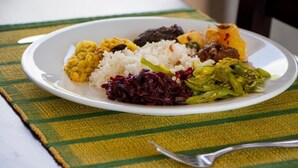 A plate of food with rice, vegetables, and a meat dish. - jasmin villa ayurveda resort (Negombo)