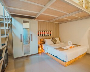A bedroom with a bed, a wardrobe, a built-in shelf, and a wall-mounted artwork.