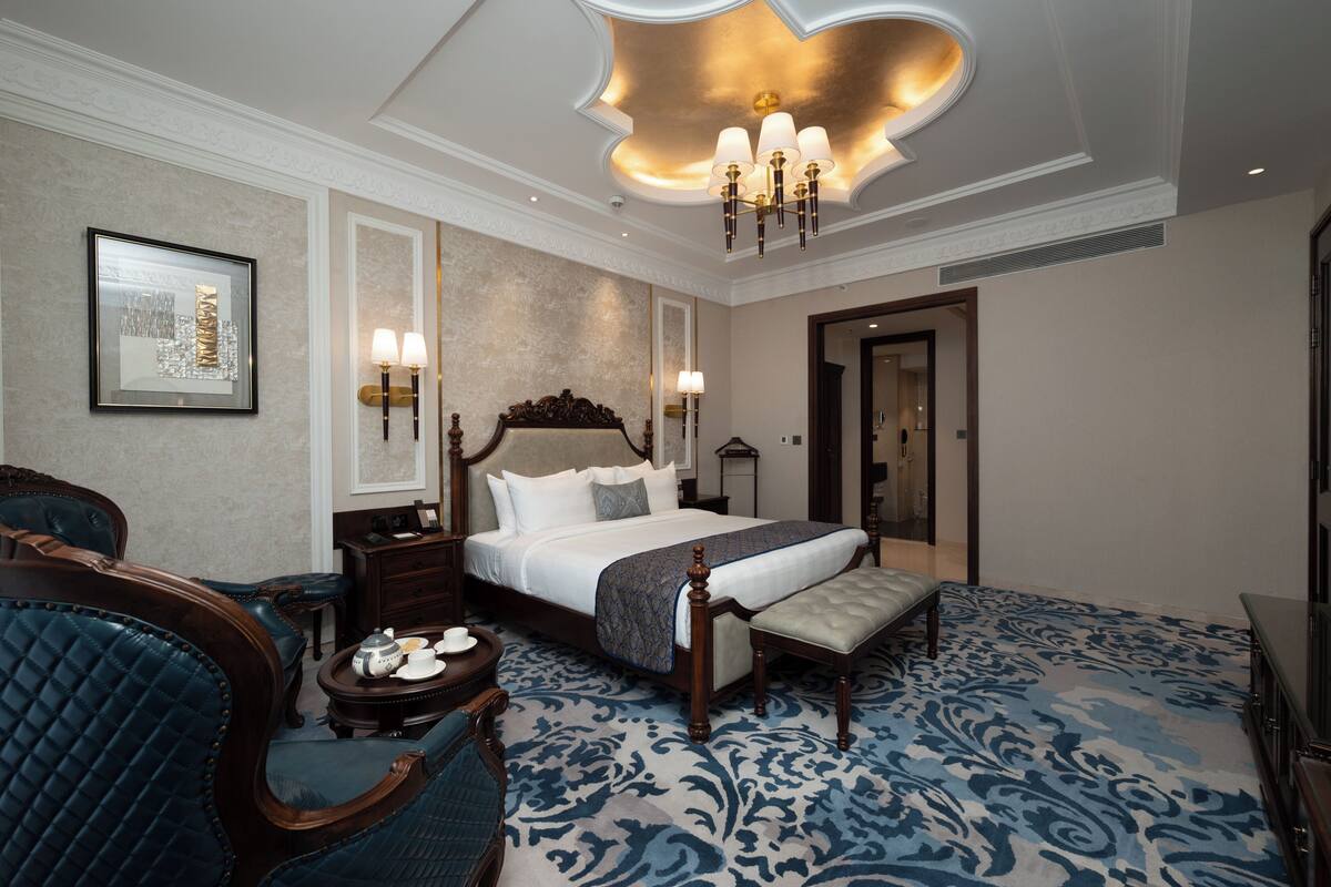 Suite presidencial | Ropa de cama de alta calidad y minibar