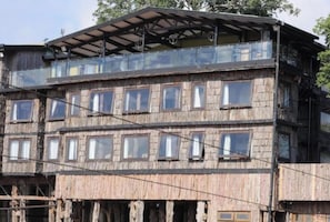 A multi-story wooden building with balconies and large windows. - The Treetops Lodge (Aberdare National Park)