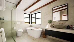 A modern bathroom with a freestanding bathtub, a glass shower enclosure, and a large mirror. - Stunning Cabin with a Private Hot Tub and Views of Bunya Mountain, Perfect for a Queensland Getaway (Neumgna)