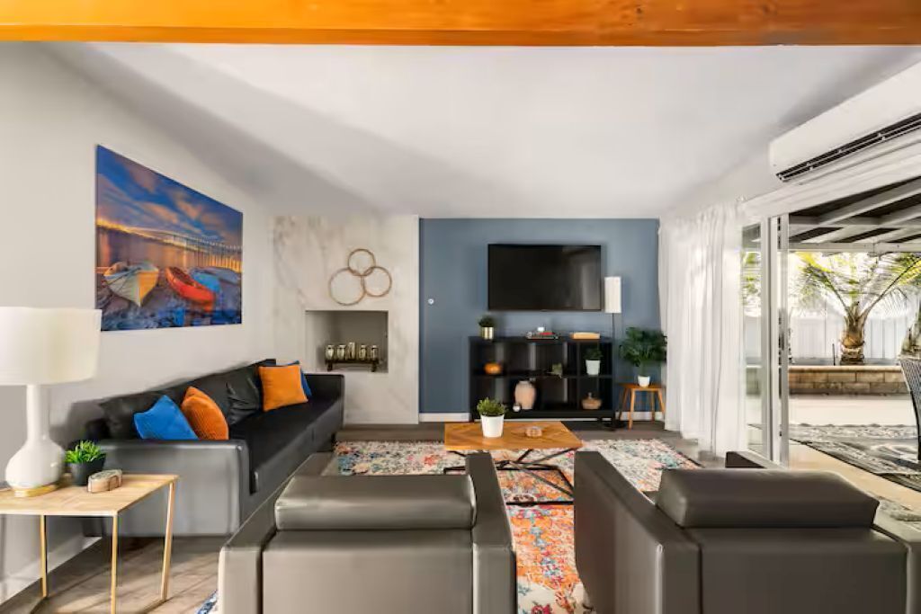 Smart TV, fireplace, books, printers