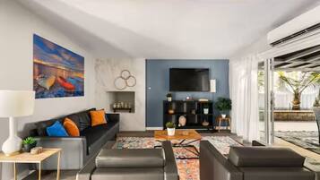 Smart TV, fireplace, books, printers