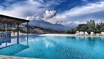 Seasonal outdoor pool, pool loungers