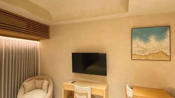 Une chambre à coucher moderne avec un lit, un bureau, une chaise, un téléviseur et un tableau accroché au mur.