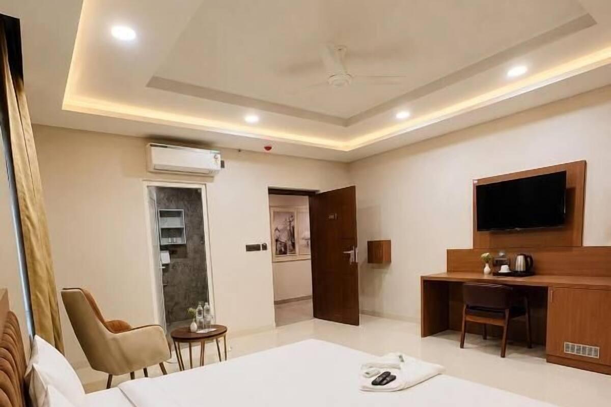 Deluxe Double Room, Hill View | Minibar, in-room safe, desk, laptop workspace