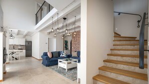 A spacious living area with a staircase, a kitchen, and a dining area. - Villa BrickOliva (100551-K1) - Porec (Porec)