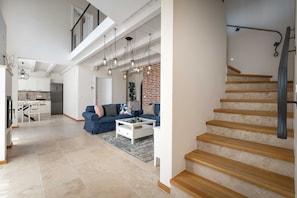 A spacious living area with a staircase, a kitchen, and a dining area. - Villa BrickOliva (100551-K1) - Porec (Porec)