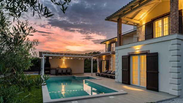 A modern house with a swimming pool, a covered patio, and a brick exterior. - Villa BrickOliva (100551-K1) - Porec (Porec)