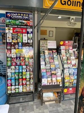 A travel information kiosk with various brochures and maps.