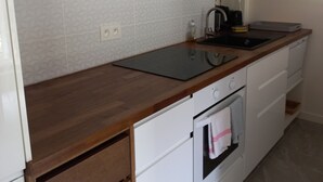 A kitchen with a microwave, oven, and a wooden countertop. - Charming, in a typical chalet and hamlet (Les Contamines-Montjoie)