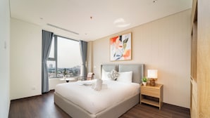 A modern hotel room with a large bed, a bedside table with a lamp, a window with curtains, and a city view. - Luminous - Kieu by KITA Luxury Apartment (Ho Chi Minh City)