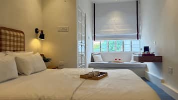 Deluxe Room, City View | Individually decorated, individually furnished, desk, laptop workspace