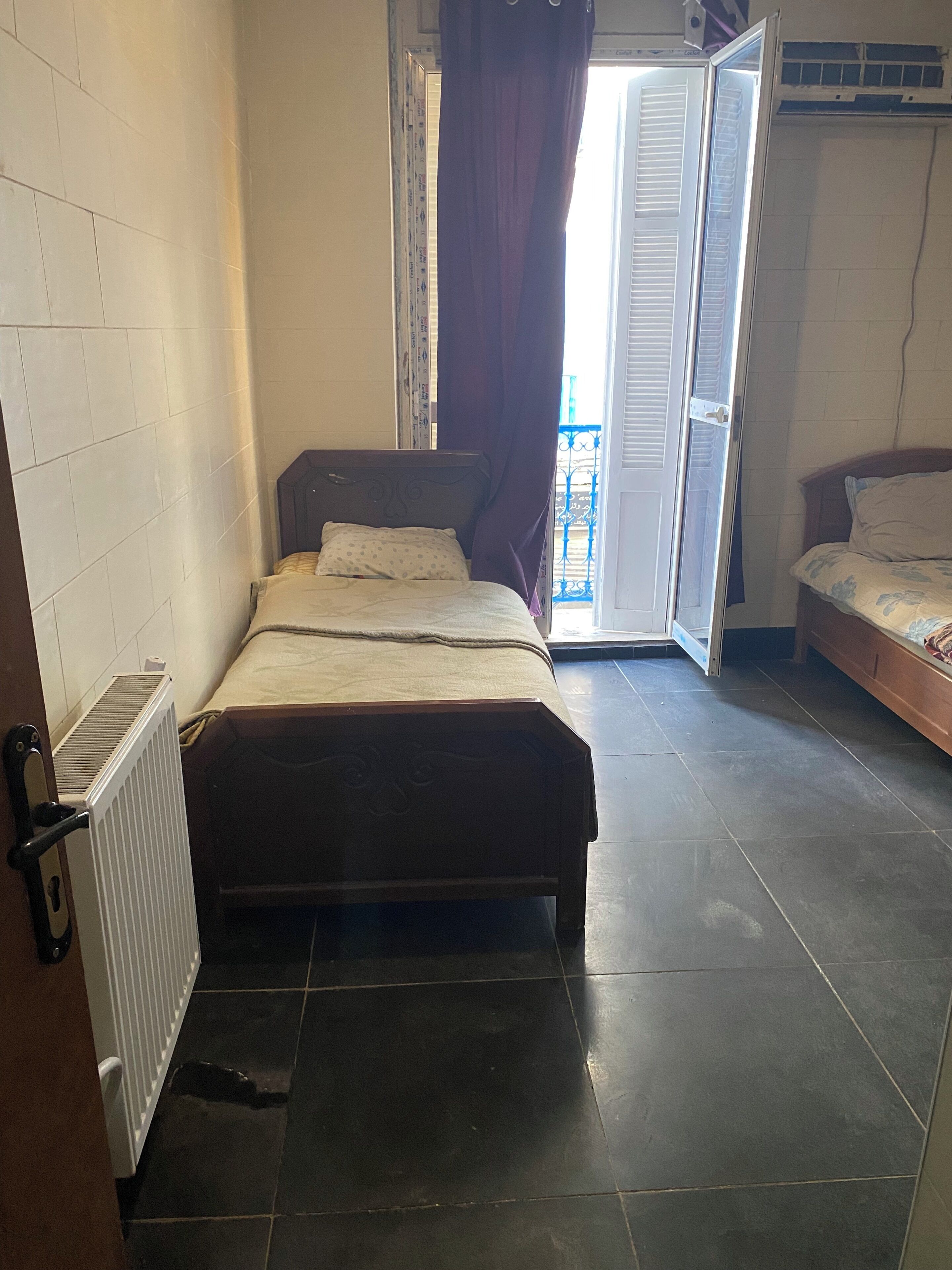 Basic Double Room, Balcony, City View | Laptop workspace, WiFi (free), bed sheets