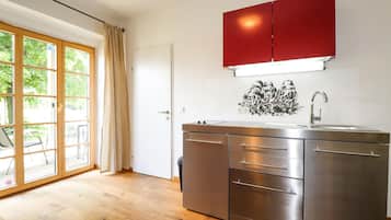 Fridge, stovetop, dishwasher, coffee/tea maker