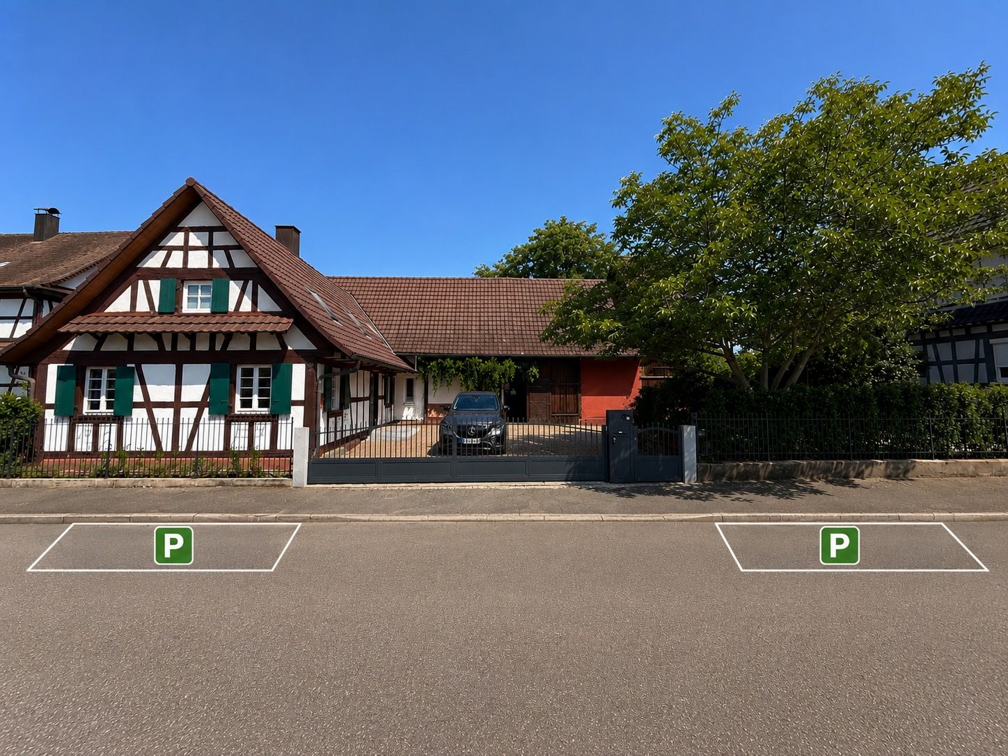 A traditional half-timbered building with a parking lot in front.