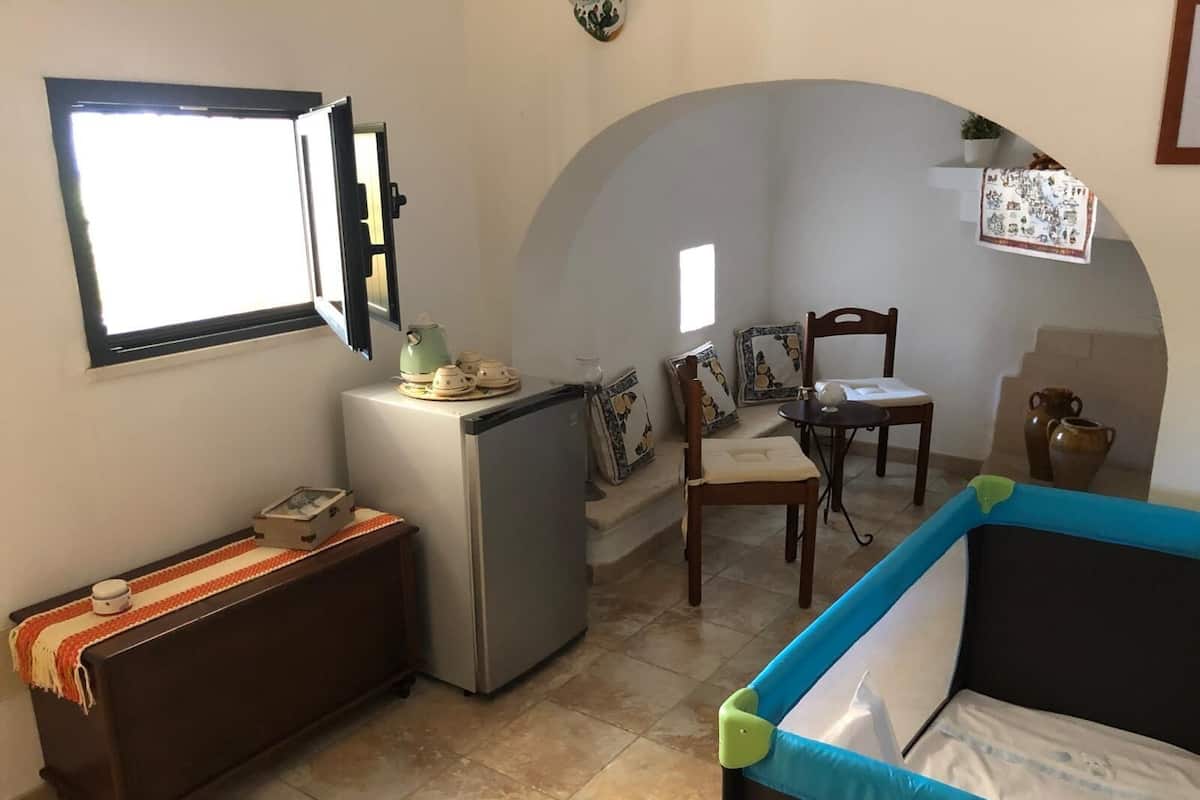 Deluxe Suite, Pool View | Laptop workspace, WiFi (free), individually decorated
