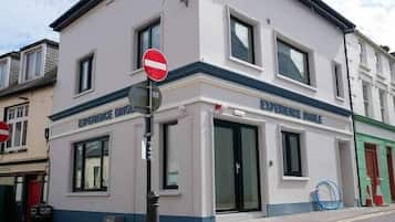 A building with a sign reading 'EXPERIENCE DING.'
