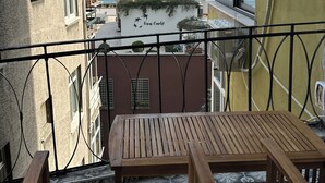 A balcony with a view of the city, a table, and a chair. - Serene Stylish Central Cihangir Flat w/ Bosphorus 3-bedroom apartment (Beyoglu)