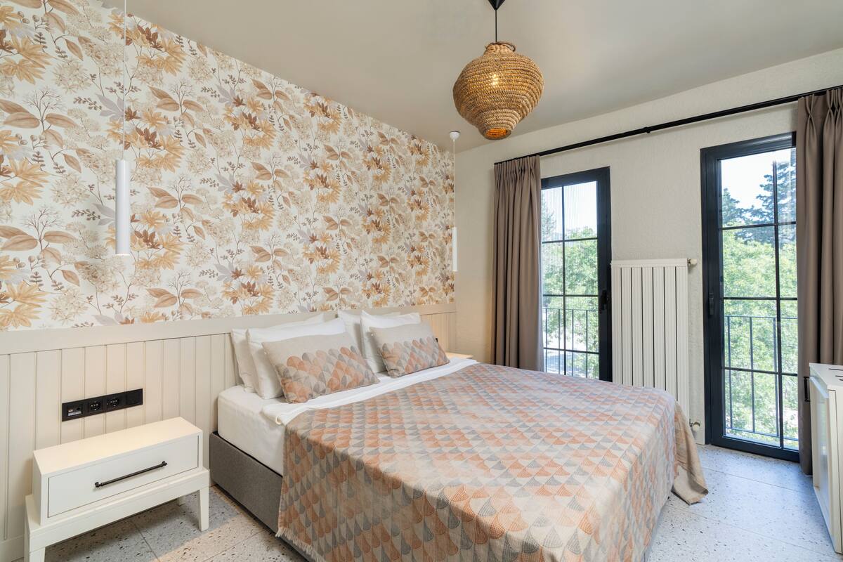 Habitación estándar, vista al jardín | Sábanas de algodón egipcio, ropa de cama de alta calidad y minibar 