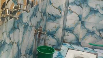 Comfort Quadruple Room, City View | Bathroom | Shower, free toiletries, slippers, towels