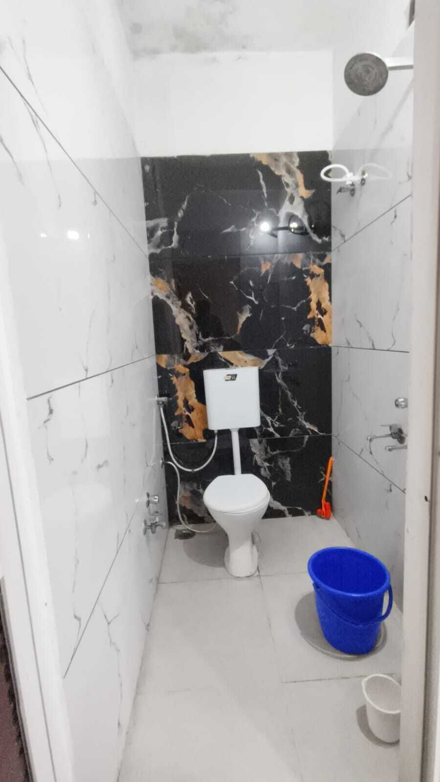Comfort Quadruple Room, City View | Bathroom | Shower, free toiletries, slippers, towels