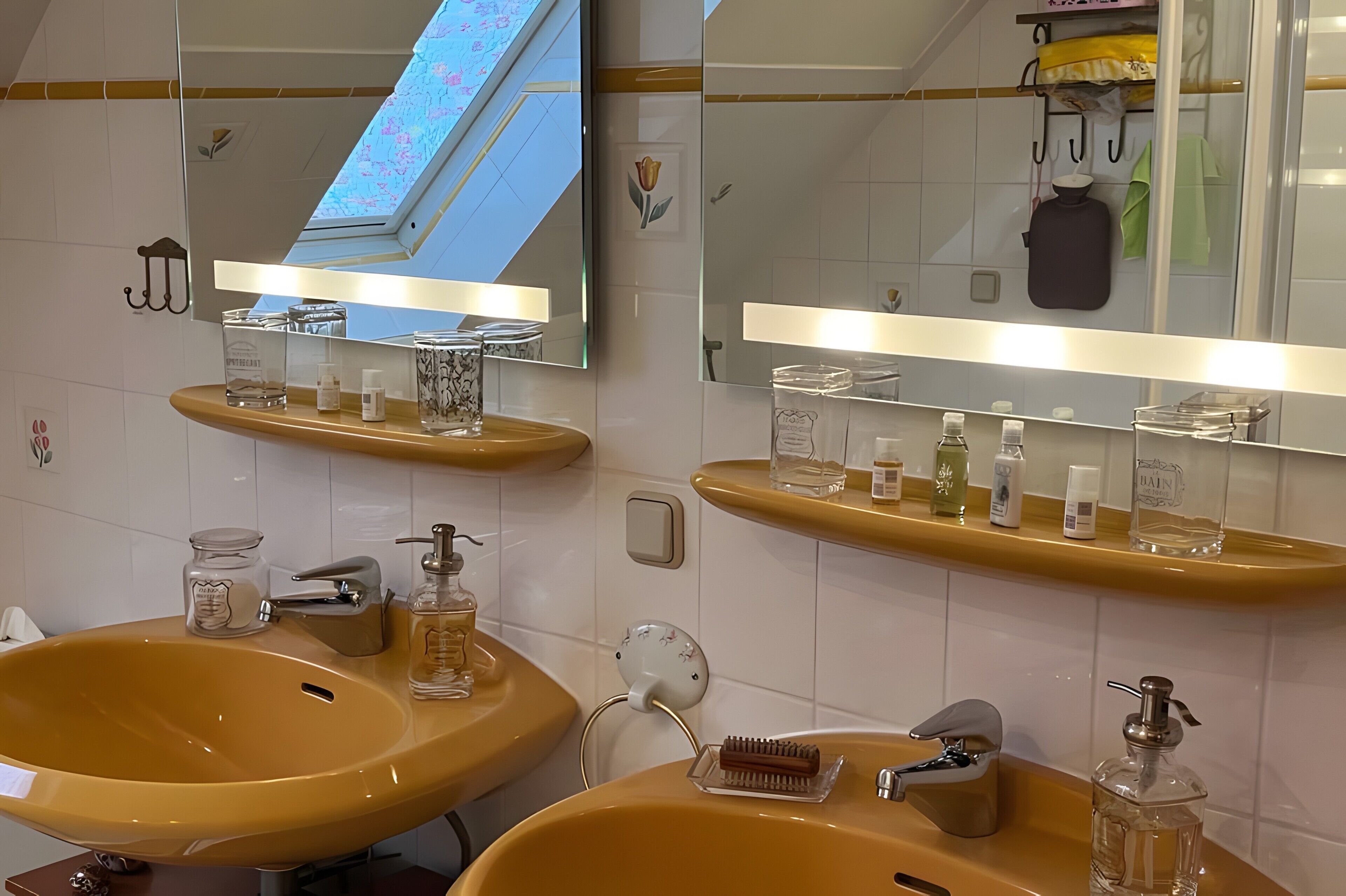 A bathroom with two sinks, a mirror, and shelves with toiletries.