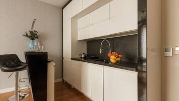 Comfort Apartment, City View | Private kitchenette | Fridge, microwave, stovetop, dishwasher