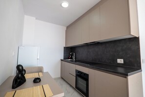 Suite, Balcony, Sea View | Private kitchen | Fridge, oven, stovetop - SeaScape Residence (Borsh)