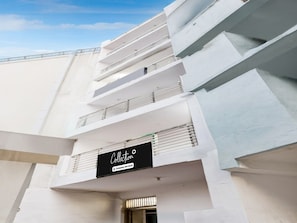 A modern building with a sign that reads 'Collection Company-Serviced.' - Super Collection O Sector 18 (Noida)