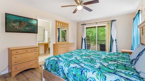 A bedroom with a bed, a ceiling fan, a dresser, a mirror, and a window with curtains. - Casa Palermo At Regal Palms (Davenport)