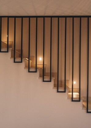 A staircase with a modern design, featuring a series of steps and handrails. - ORA BLU (PREVEZA)