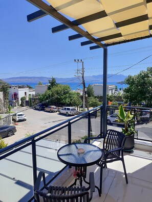 Outdoor dining - Serene 2-bedroom house with AC in charming Bodrum Akyarlar balcony sea view (BODRUM)