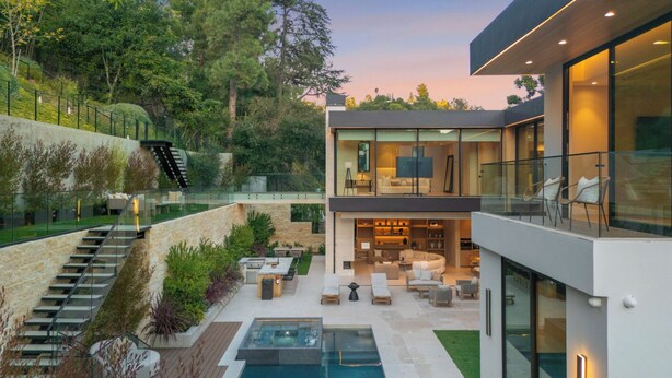 A modern house with a pool, outdoor seating, and a staircase leading to a deck. - Hutton Villa (Beverly Hills)