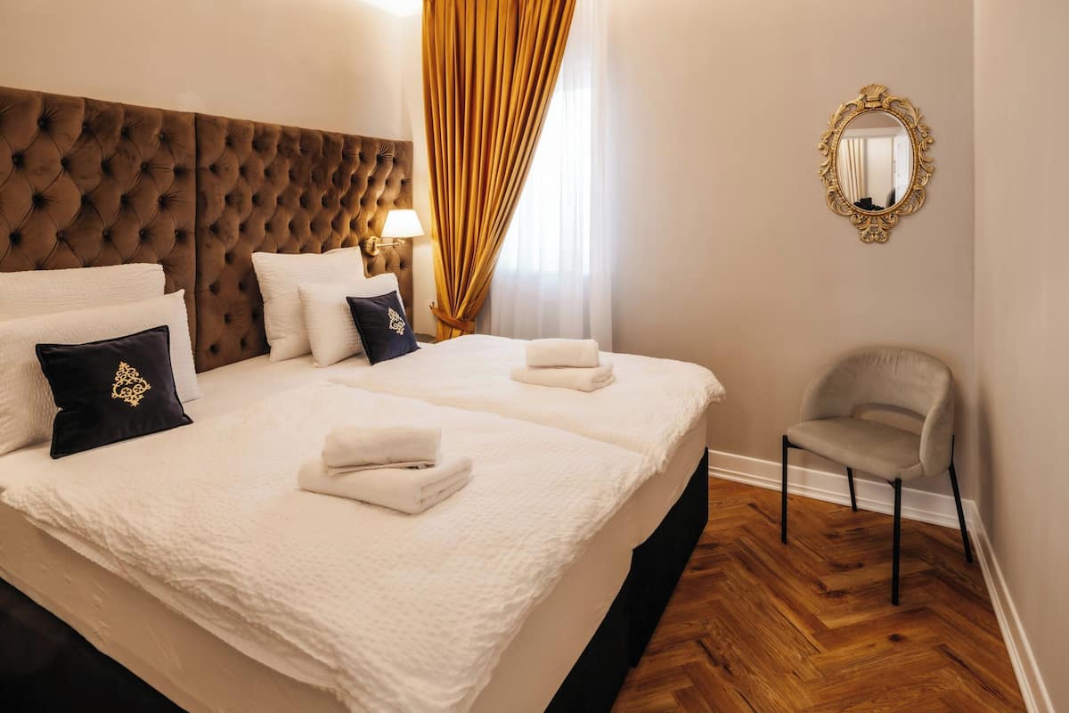 One-Bedroom Suite | Soundproofing, cribs (free), WiFi (free), individually decorated