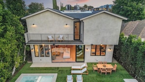 A modern two-story house with a spacious patio, a swimming pool, and a well-maintained lawn. - Kraft Villa (North Hollywood)