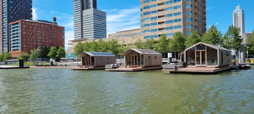 Wrap Boat No. 2 at Floating Rotterdam Rijnhaven with open swimmingpool nextdoor