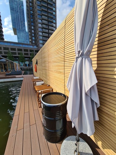 Wrap Boat No. 2 at Floating Rotterdam Rijnhaven with open swimmingpool nextdoor