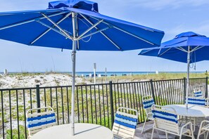 Outdoor dining - Pelican Beach #2004 | Gulf Front in Destin + Amenities (Destin)
