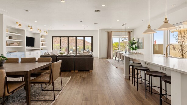 A modern kitchen with a dining area, built-in shelves, a large window, and a view of the outdoors. - St. George Oasis: Private Pool + Cold Plunge! (Washington)