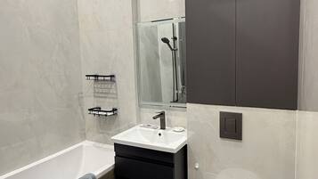 Hair dryer, bidet, towels, toilet paper
