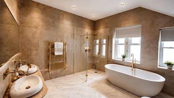 Separate bathtub and shower, deep-soaking bathtub, towels