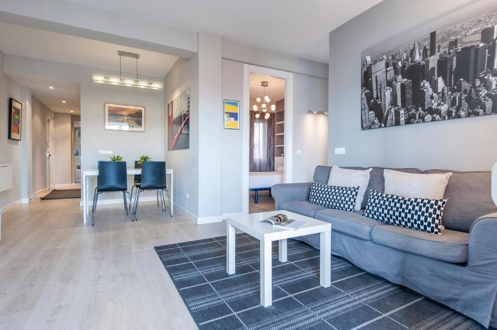 Apartment | Living area | 32-inch flat-screen TV with cable channels