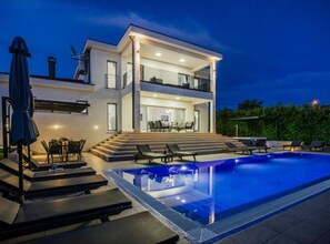 A modern two-story house with a swimming pool, outdoor seating, and a staircase leading to the upper floor. - Villa Antonija With Outdoor Pool (Imotski)