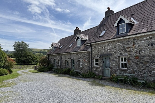 Buzzards cottage is the third cottage from the left hand side