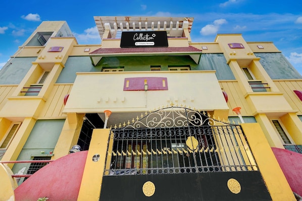A building with a black sign reading 'Collection & Company Services.' - Collection O Kelambakkam Chennai (Tirupporur)