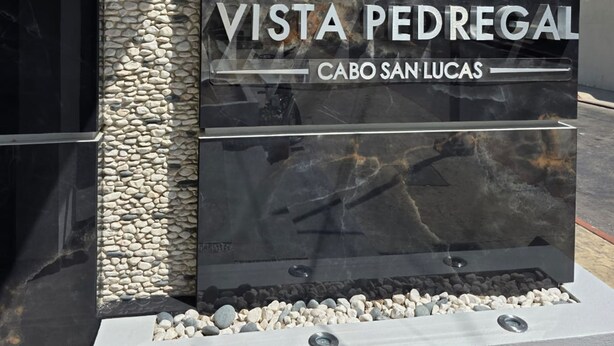 A sign for Vista Pedregal with a logo and location name. - Vista Pedregal Comfortable Apartment in Cabo San Lucas Golden Zone (Cabo San Lucas)